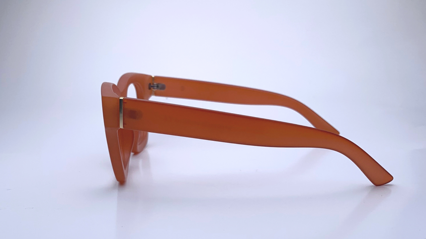 Ariel In Persimmon Crystal:   Modified Cat Eye Frame Fits Medium To Wide Faces